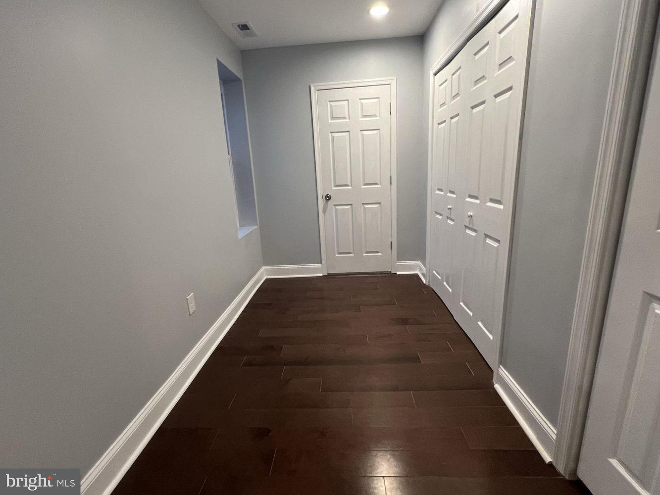 1607 East Biddle Street Baltimore, MD 21213 - Photo 12 of 23 a view of a hallway with wooden floor
