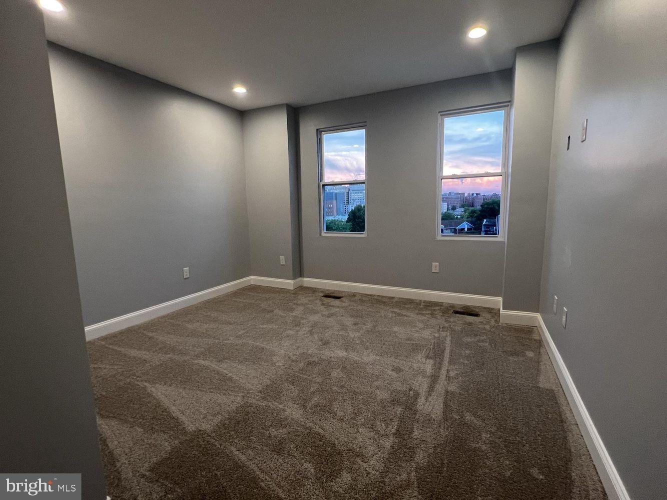 1607 East Biddle Street Baltimore, MD 21213 - Photo 15 of 23 an empty room with windows