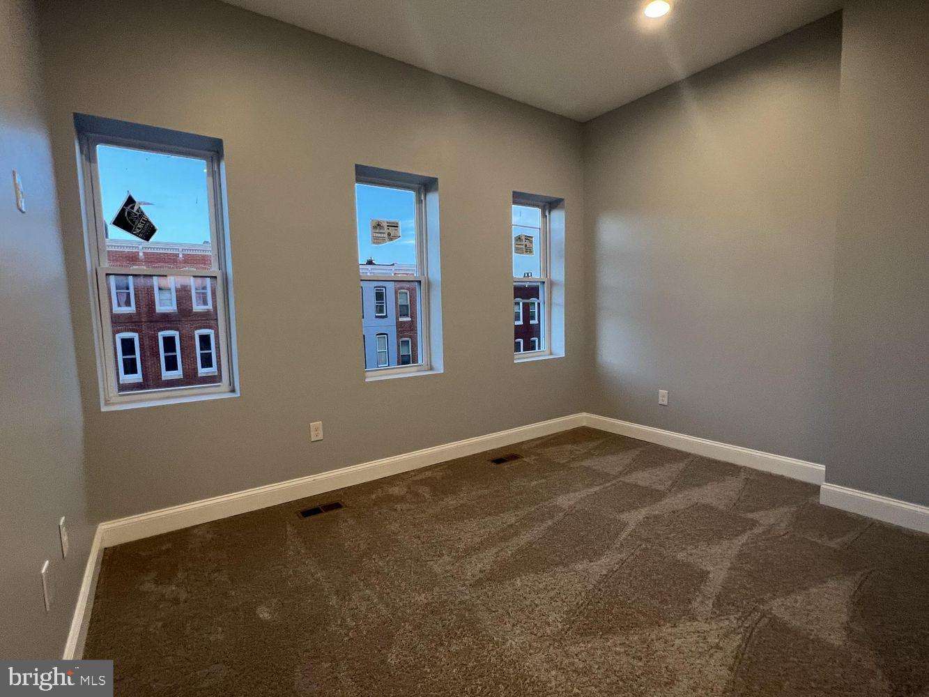 1607 East Biddle Street Baltimore, MD 21213 - Photo 18 of 23 a view of an empty room with a window