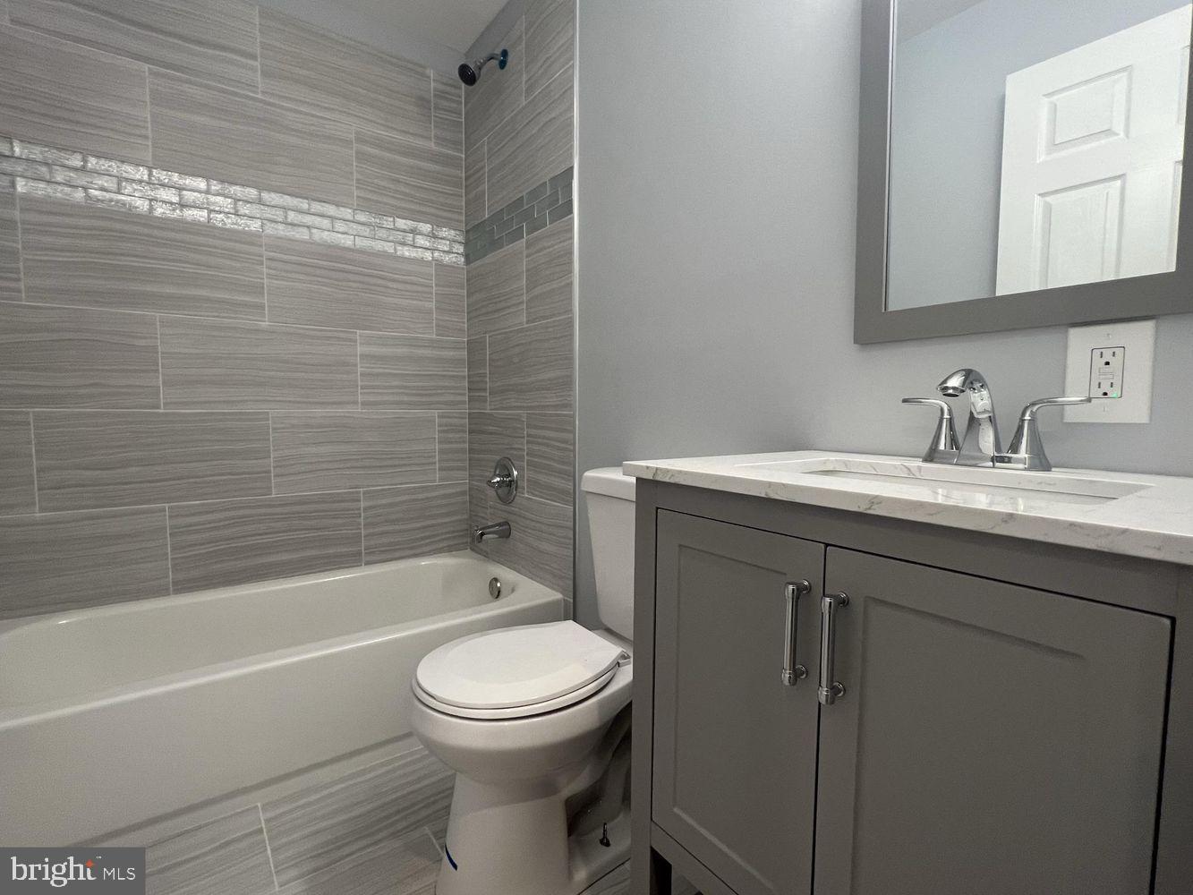 1607 East Biddle Street Baltimore, MD 21213 - Photo 20 of 23 a bathroom with a sink toilet and shower
