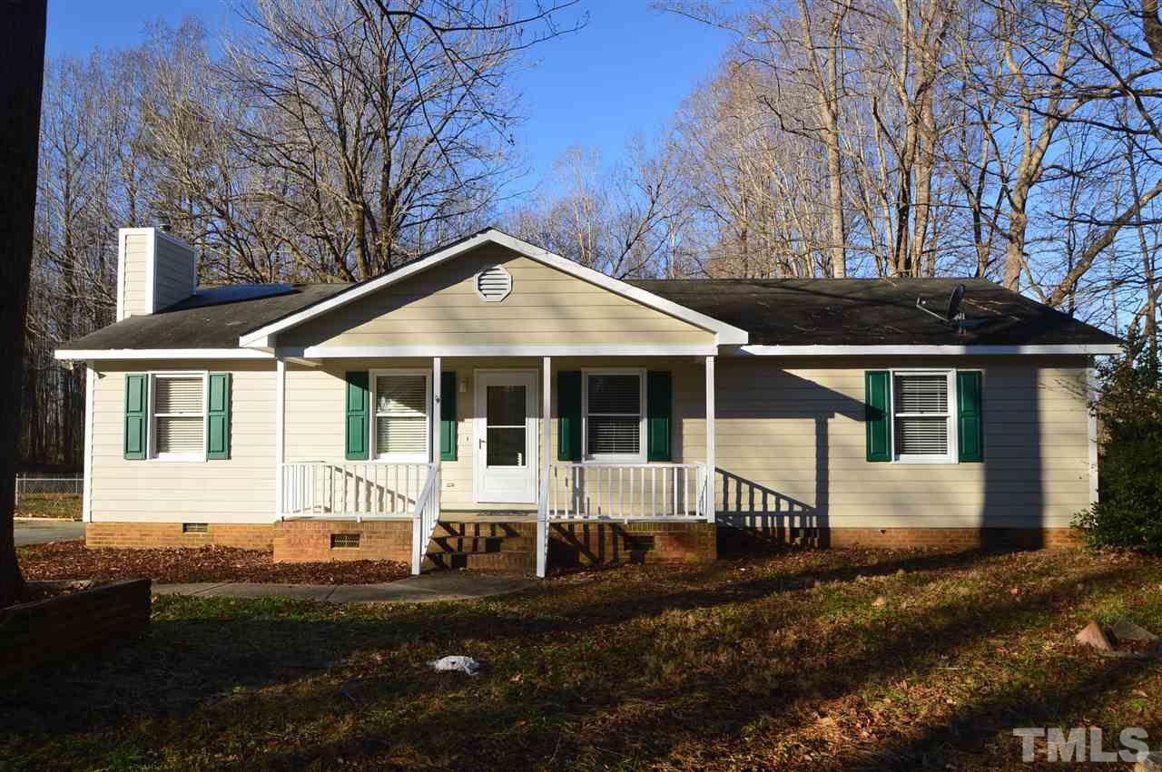 6801 Kiger Road Rougemont, NC 27572 - Photo 1 of 25 a front view of a house with a yard