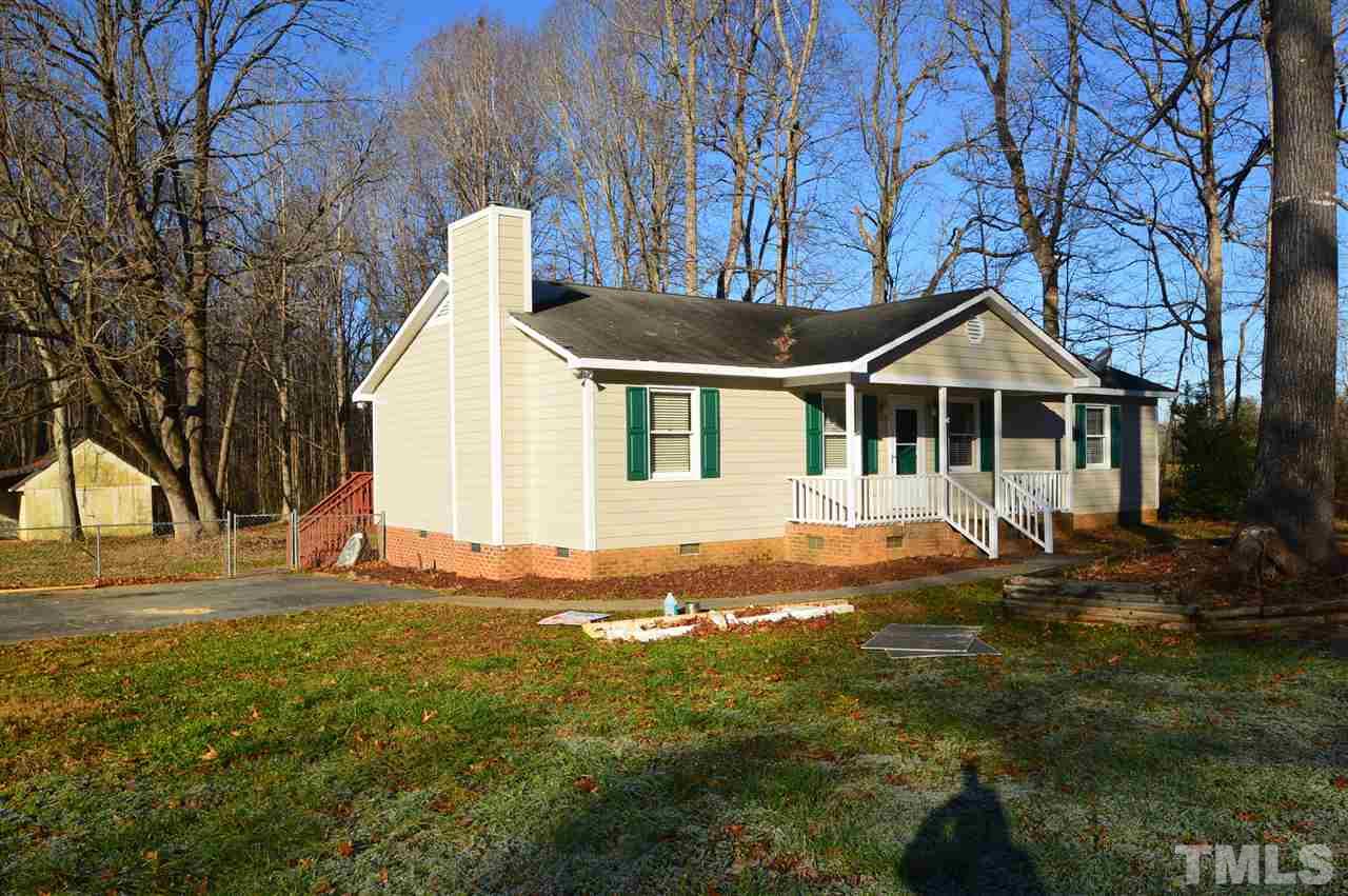 6801 Kiger Road Rougemont, NC 27572 - Photo 2 of 25 a front view of a house with a yard