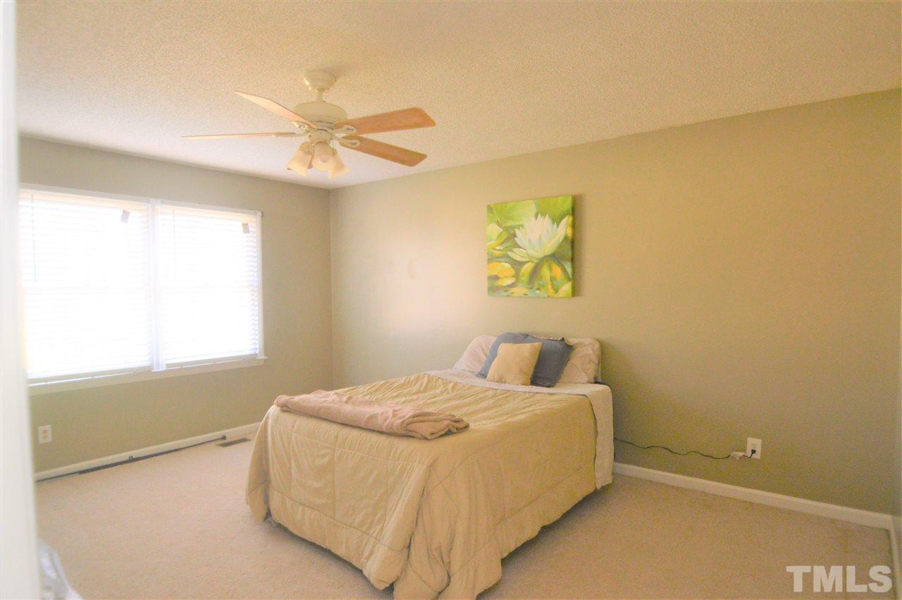 6801 Kiger Road Rougemont, NC 27572 - Photo 13 of 25 a bedroom with a bed and a window