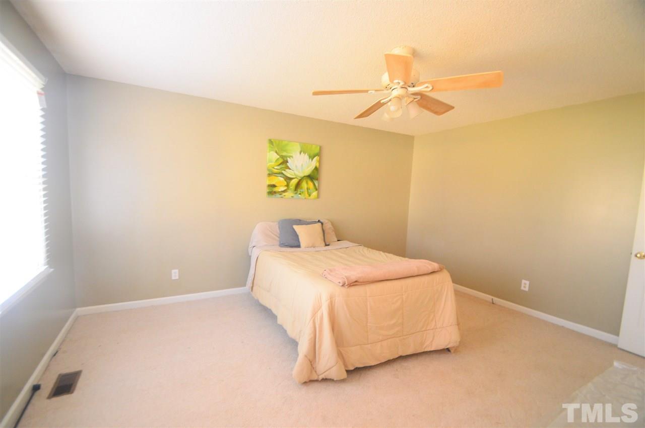6801 Kiger Road Rougemont, NC 27572 - Photo 16 of 25 a bedroom with a bed and a window
