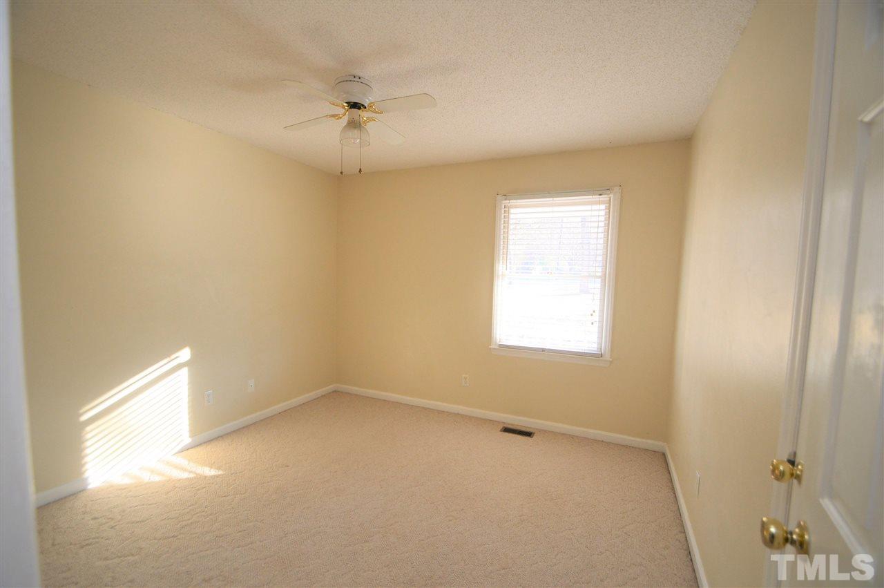 6801 Kiger Road Rougemont, NC 27572 - Photo 17 of 25 an empty room with a window and a fan