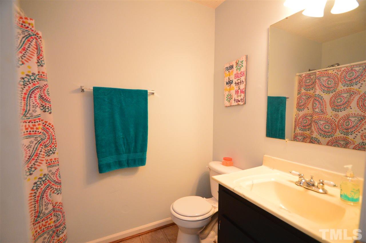 6801 Kiger Road Rougemont, NC 27572 - Photo 18 of 25 a bathroom with a sink and a mirror