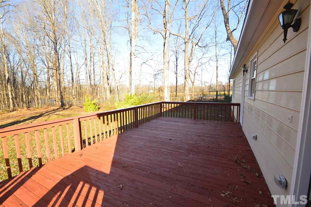 6801 Kiger Road Rougemont, NC 27572 - Photo 20 of 25 a view of a balcony with wooden floor and fence