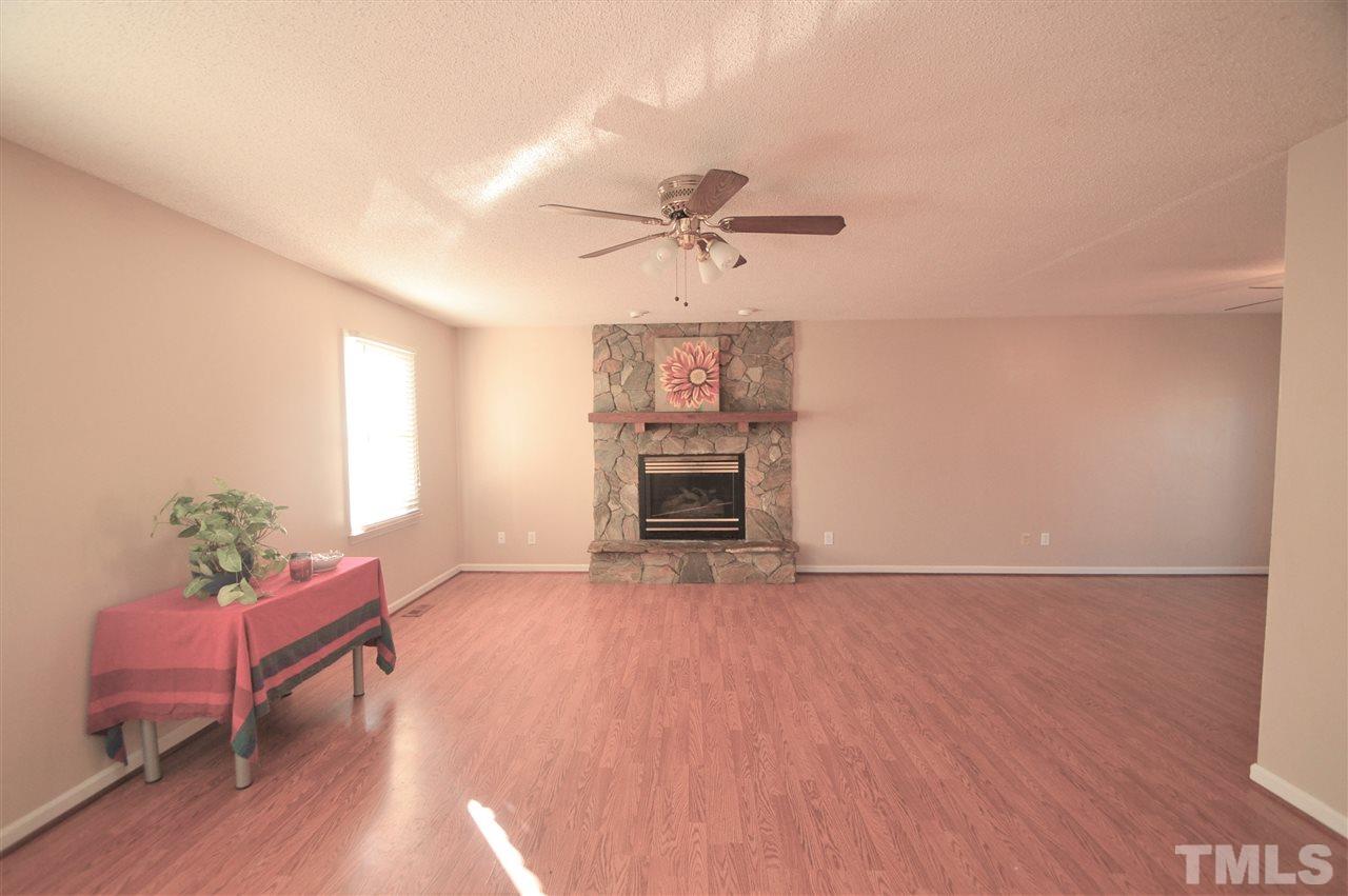 6801 Kiger Road Rougemont, NC 27572 - Photo 3 of 25 a view of a livingroom with furniture and a ceiling fan