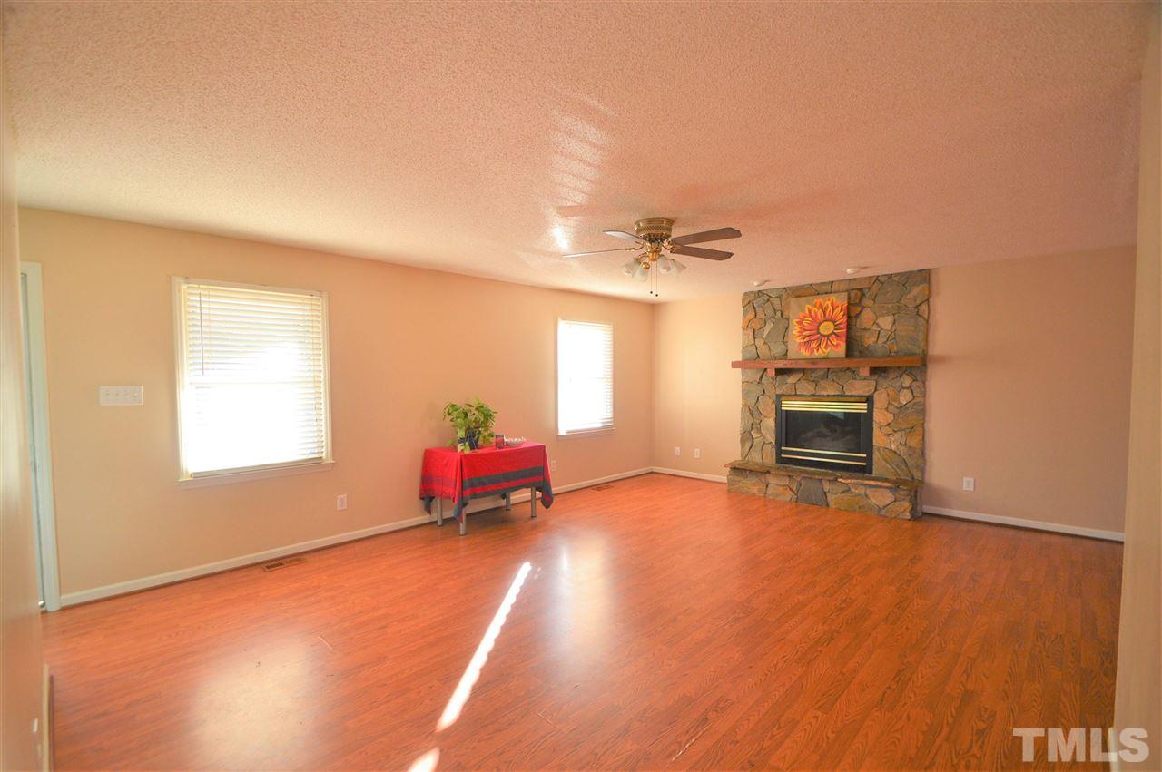 6801 Kiger Road Rougemont, NC 27572 - Photo 4 of 25 a living room with furniture and a fireplace