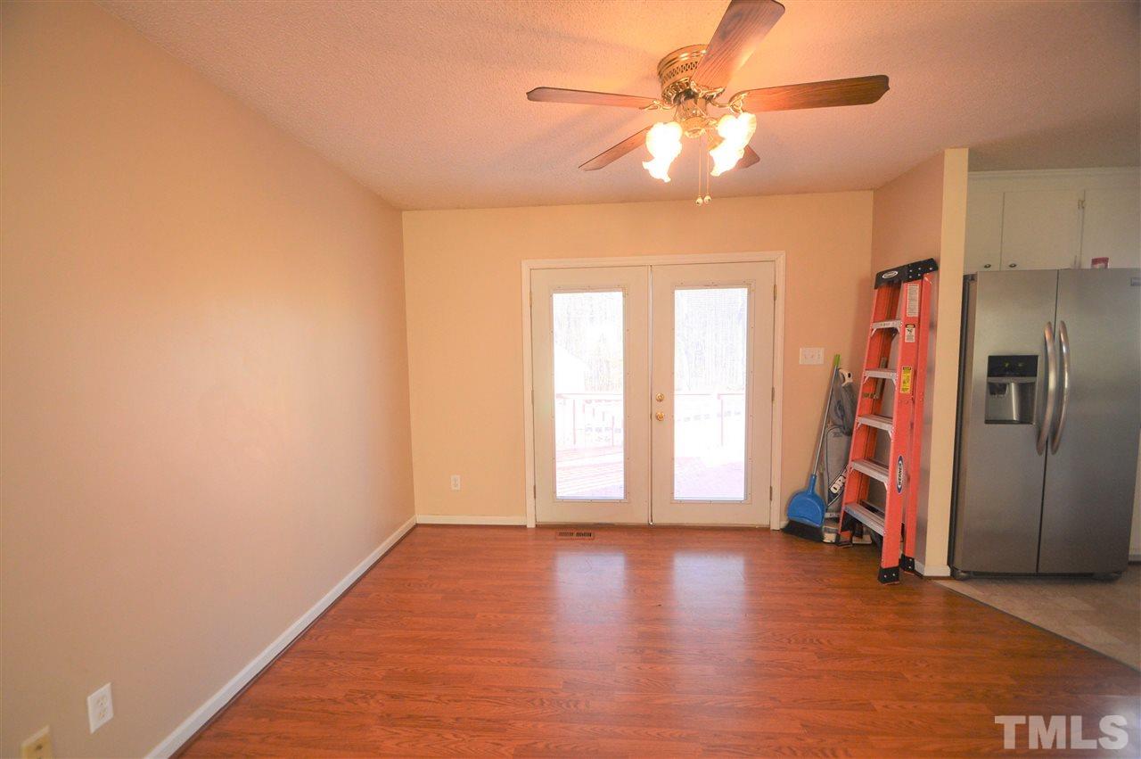6801 Kiger Road Rougemont, NC 27572 - Photo 7 of 25 an empty room with a window and a ceiling fan
