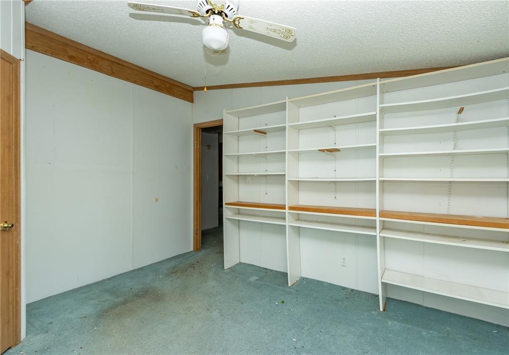 145 Shelby Lane Apollo, PA 15613 - Photo 13 of 21 a view of an empty room with a cabinet and a window