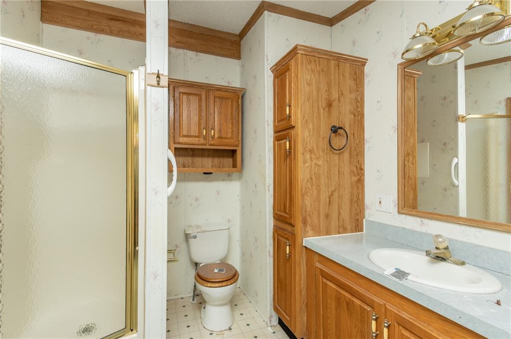 145 Shelby Lane Apollo, PA 15613 - Photo 19 of 21 a bathroom with a granite countertop sink toilet and shower