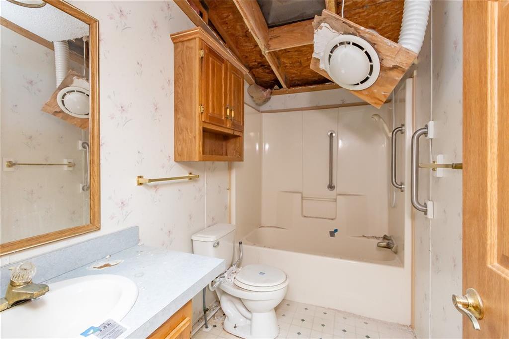 145 Shelby Lane Apollo, PA 15613 - Photo 20 of 21 a bathroom with a granite countertop sink toilet and shower