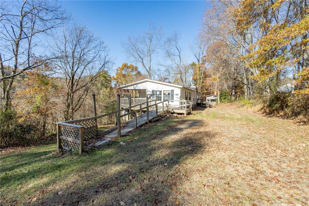 145 Shelby Lane Apollo, PA 15613 - Photo 3 of 21 a view of a yard with a house in the background