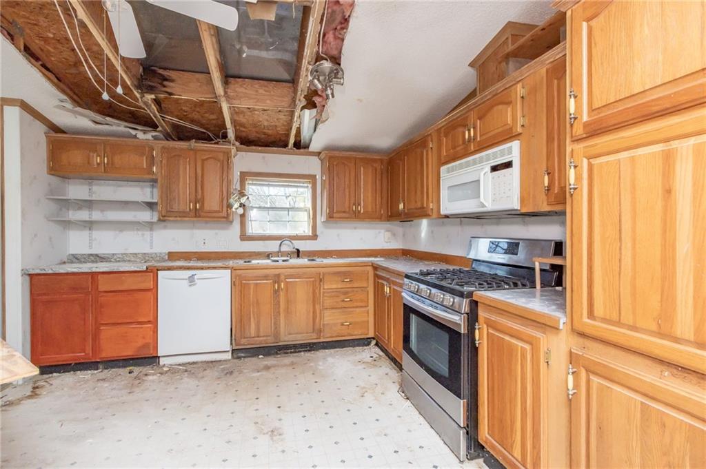 145 Shelby Lane Apollo, PA 15613 - Photo 9 of 21 a kitchen with stainless steel appliances granite countertop a stove sink and cabinets