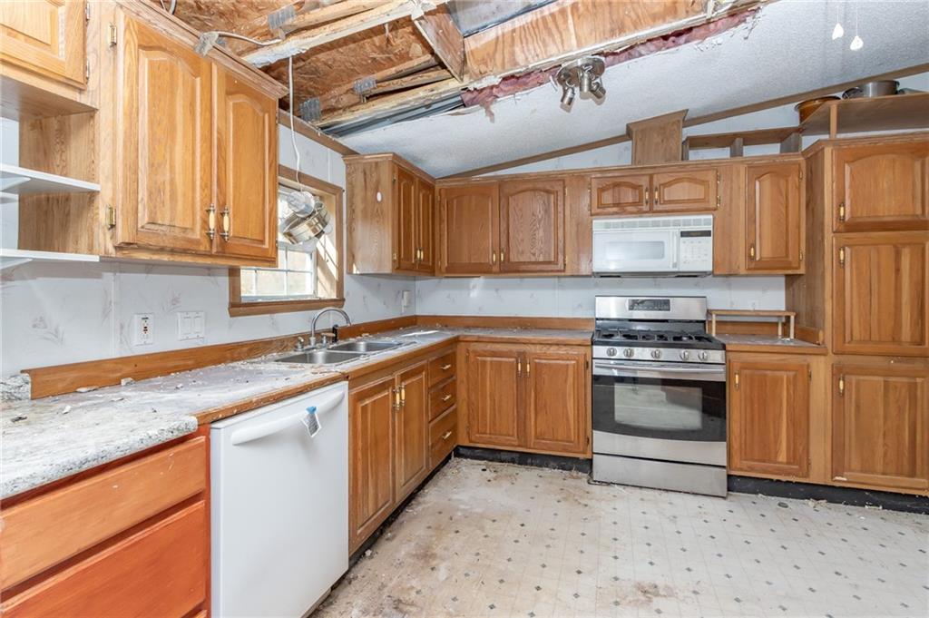145 Shelby Lane Apollo, PA 15613 - Photo 10 of 21 a kitchen with stainless steel appliances granite countertop a sink and cabinets