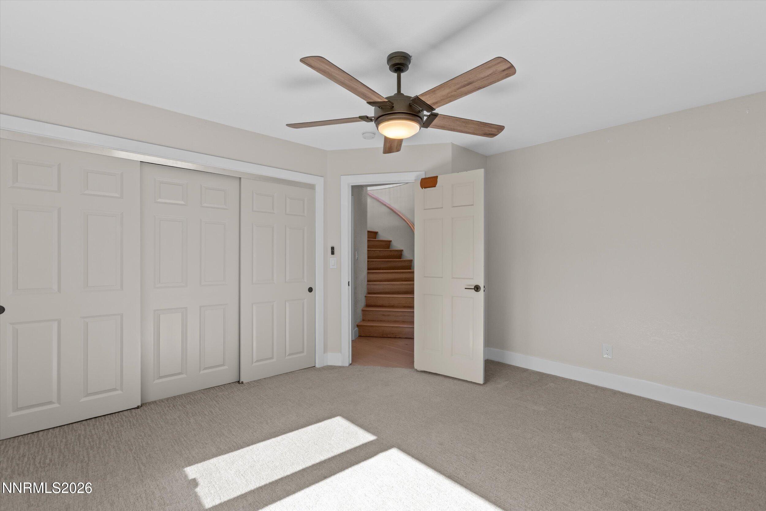 2725 West Lake Ridge Shores Reno, NV 89519 - Photo 30 of 49 a view of a livingroom with a ceiling fan and window