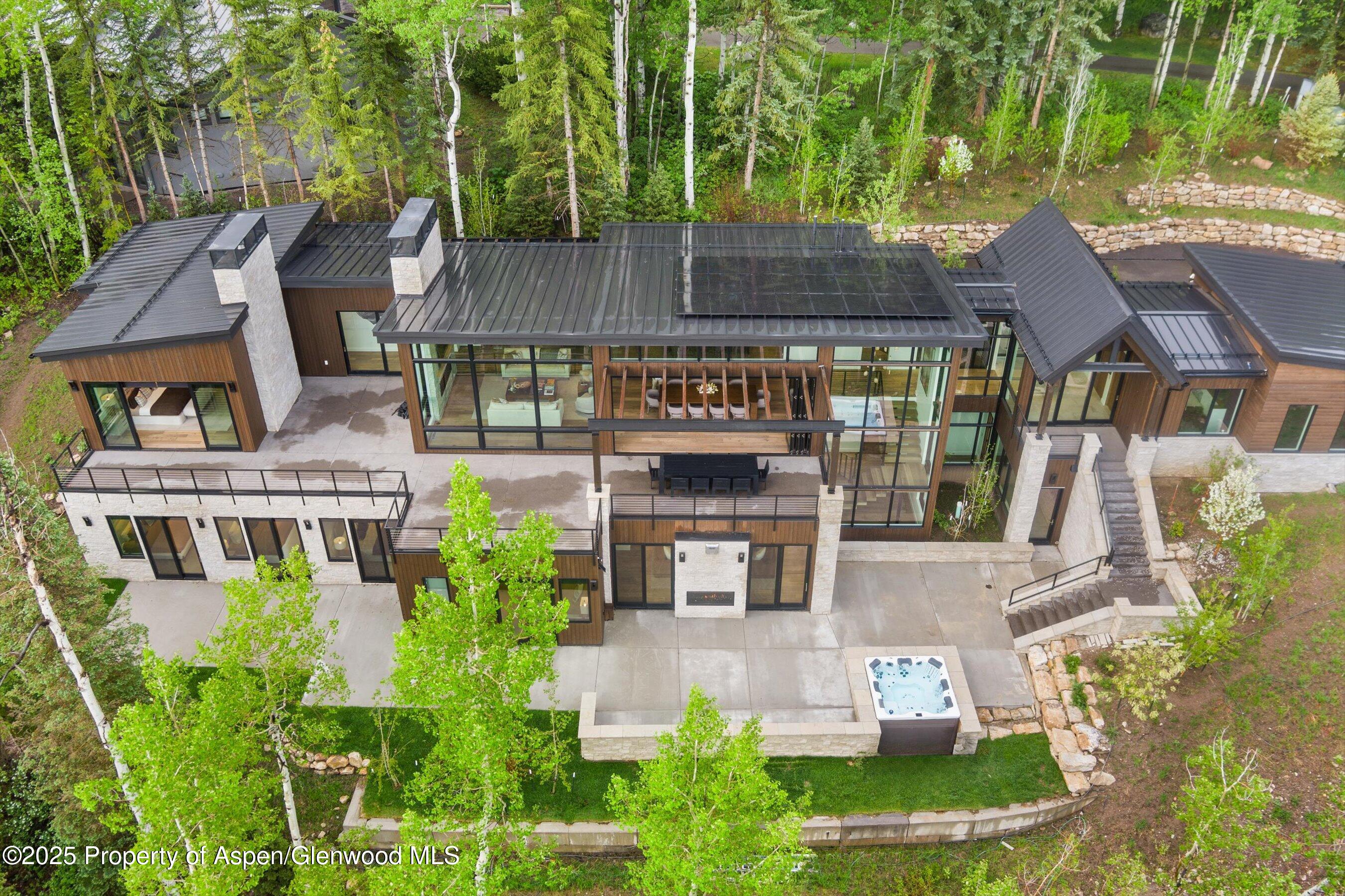 1234 Wood Road Snowmass Village, CO 81615 - Photo 5 of 66 an aerial view of a house with garden space and a street view