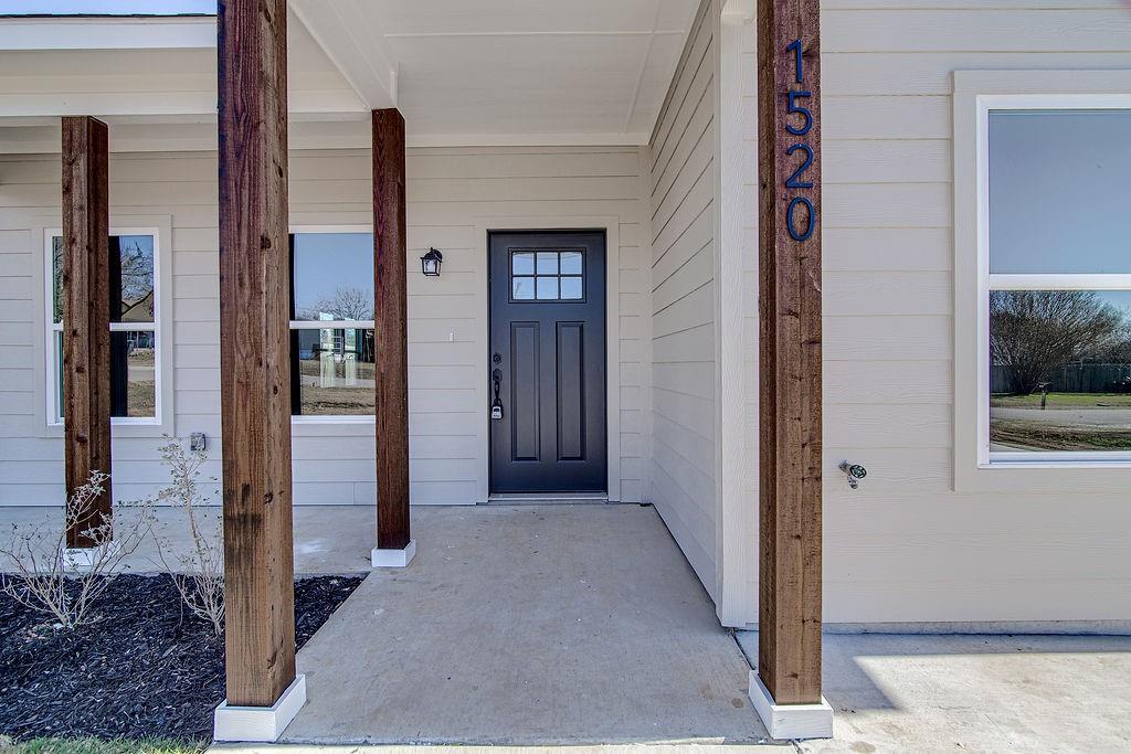 1520 Whippoorwill Way Azle, TX 76020 - Photo 2 of 25 a view of a hallway with wooden cabinets