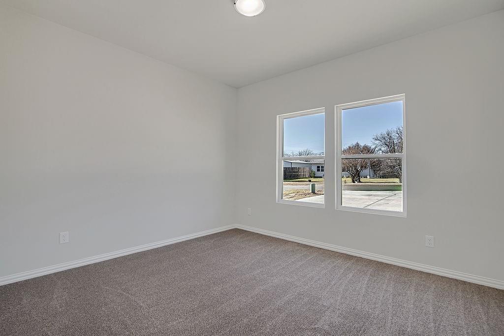 1520 Whippoorwill Way Azle, TX 76020 - Photo 22 of 25 an empty room with a window