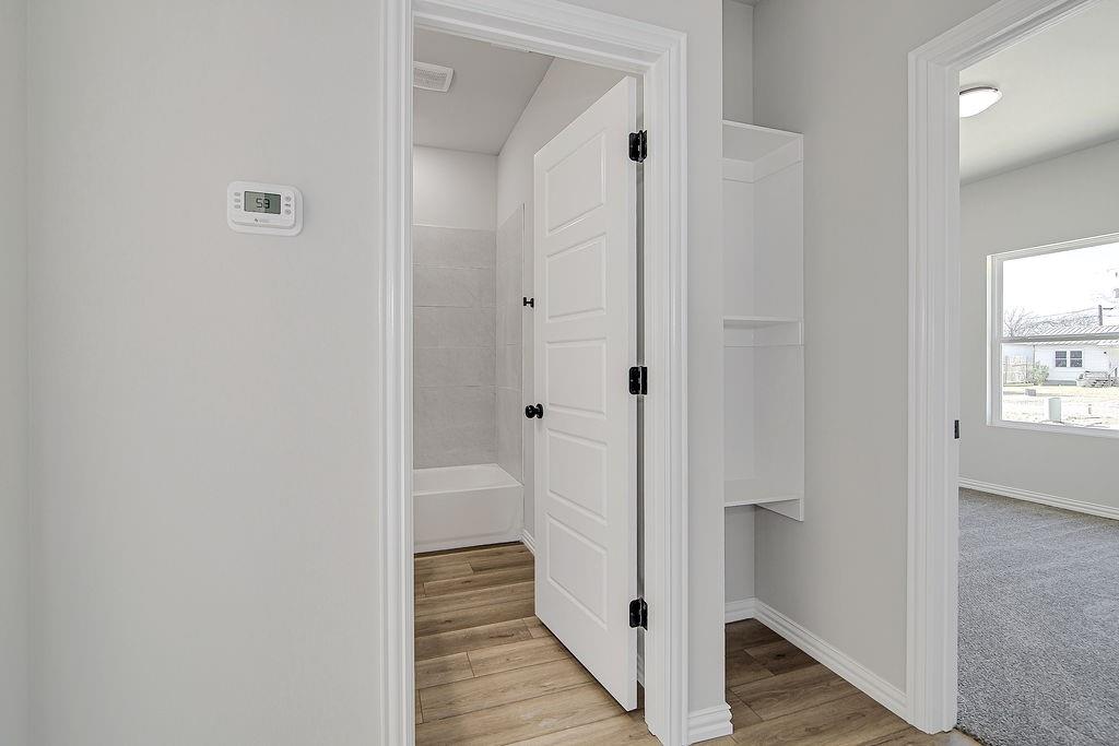 1520 Whippoorwill Way Azle, TX 76020 - Photo 24 of 25 a view of a bathroom from the hallway