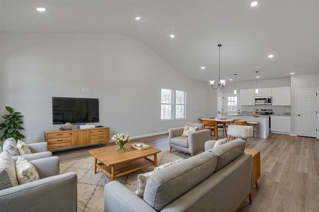 1520 Whippoorwill Way Azle, TX 76020 - Photo 4 of 25 a living room with furniture and a flat screen tv