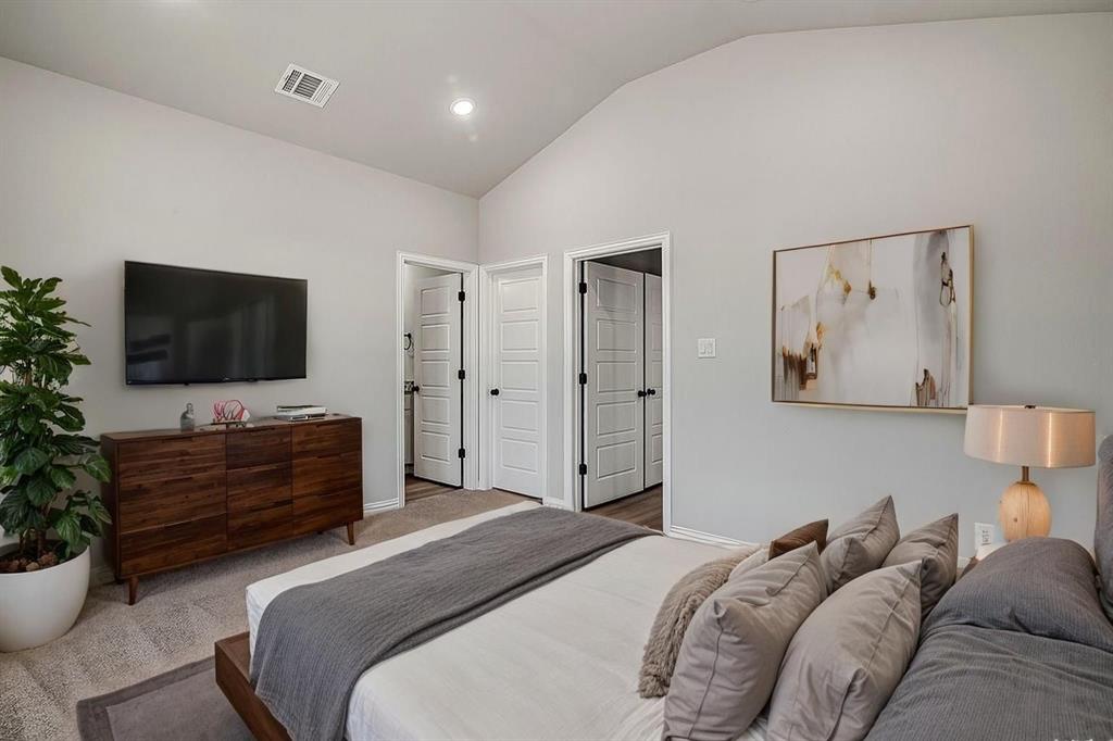 1520 Whippoorwill Way Azle, TX 76020 - Photo 5 of 25 a bedroom with a bed and a flat screen tv