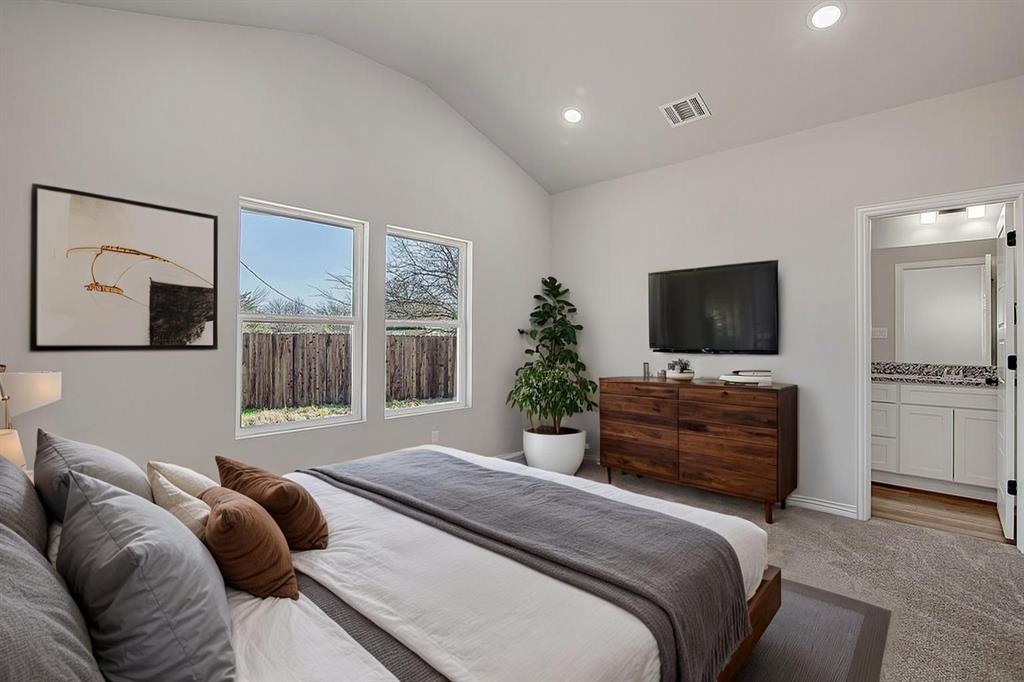 1520 Whippoorwill Way Azle, TX 76020 - Photo 6 of 25 a bedroom with a bed and a flat screen tv