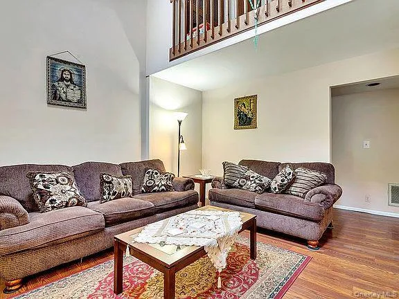 a living room with furniture and a rug