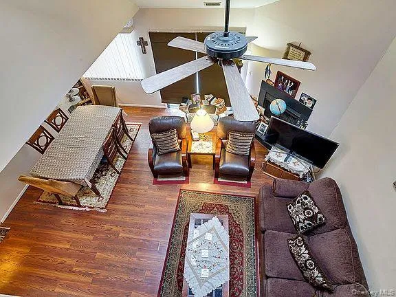 a living room with furniture and a rug