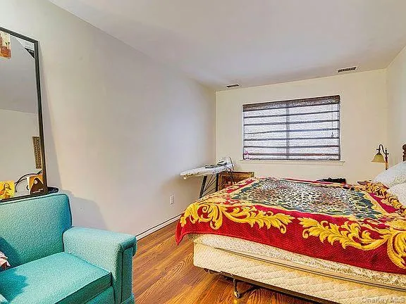 a kitchen with stainless steel appliances kitchen island granite countertop a sink a stove a table and chairs