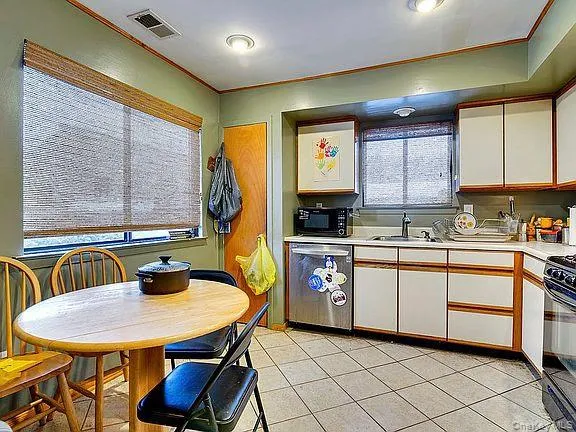 a living room with furniture a table and a window