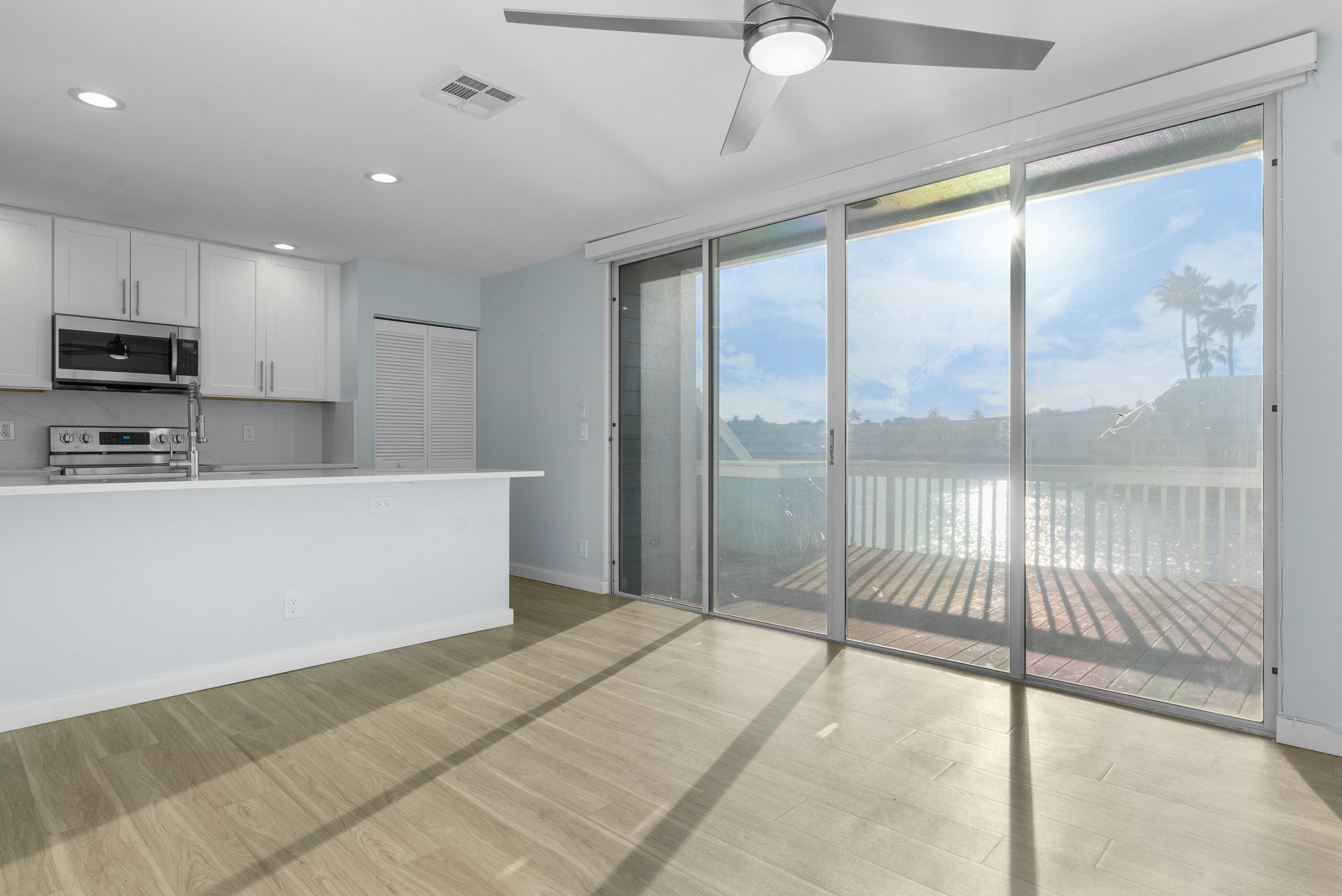 210 Ocean Dunes Circle Jupiter, FL 33477 - Photo 17 of 43 a large bedroom with a large bed and a large window