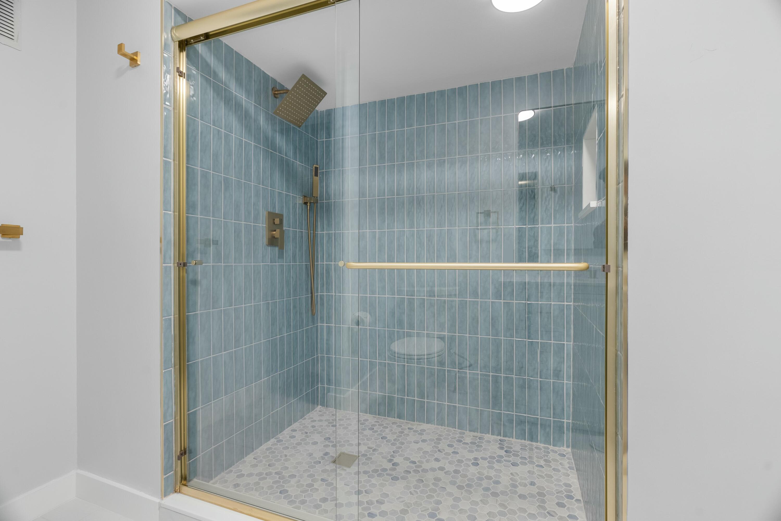 210 Ocean Dunes Circle Jupiter, FL 33477 - Photo 33 of 43 a bathroom with a shower