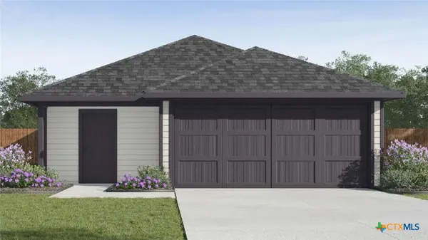 a front view of house with a garden