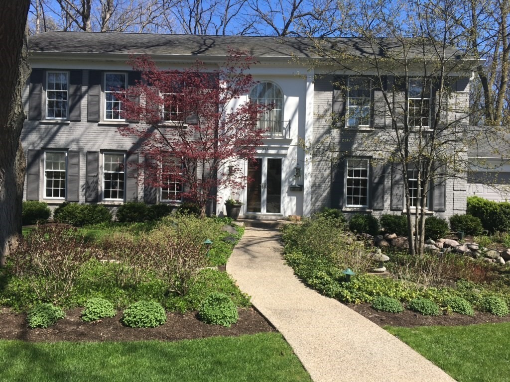 755 Smoke Tree Road Deerfield, IL 60015 - Photo 1 of 35 a front view of a house with a garden