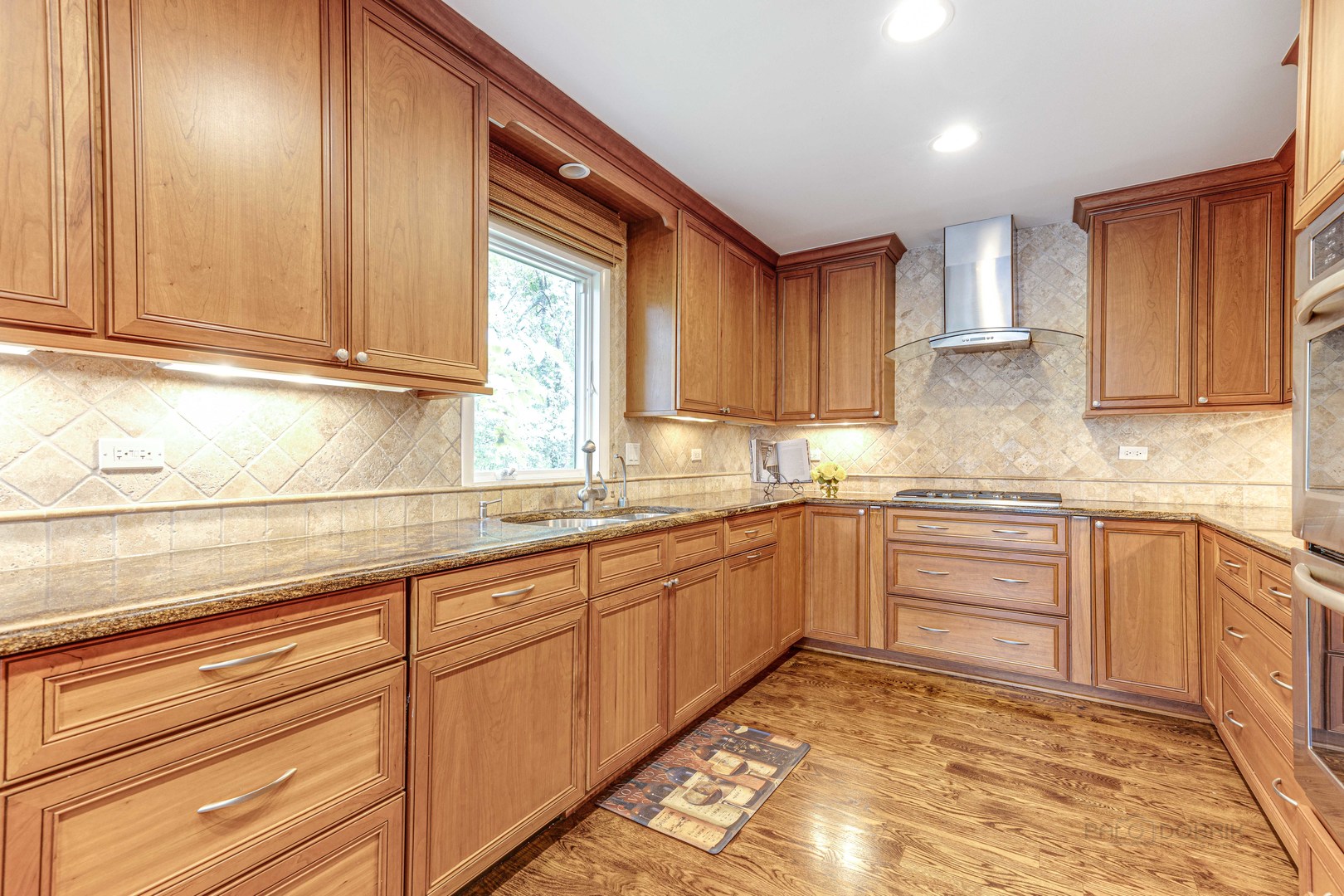 755 Smoke Tree Road Deerfield, IL 60015 - Photo 15 of 35 a kitchen with granite countertop cabinets sink and window