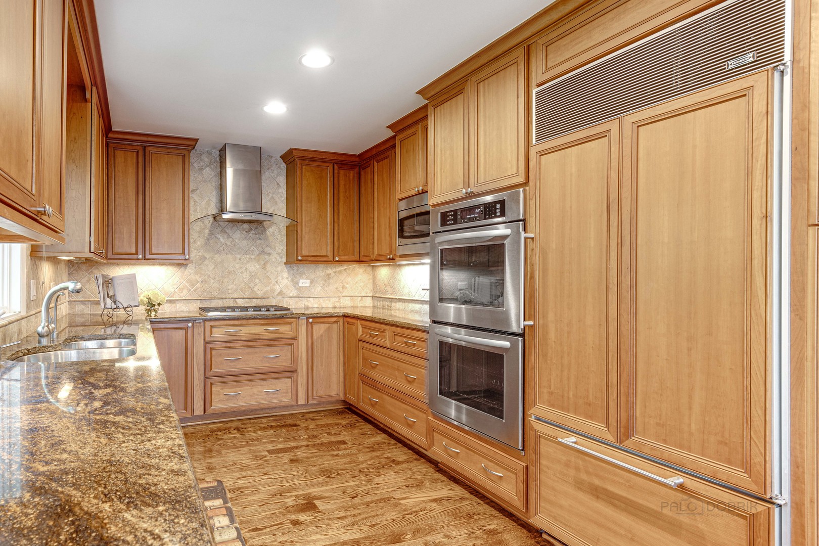 755 Smoke Tree Road Deerfield, IL 60015 - Photo 16 of 35 a kitchen with stainless steel appliances granite countertop a refrigerator sink and stove