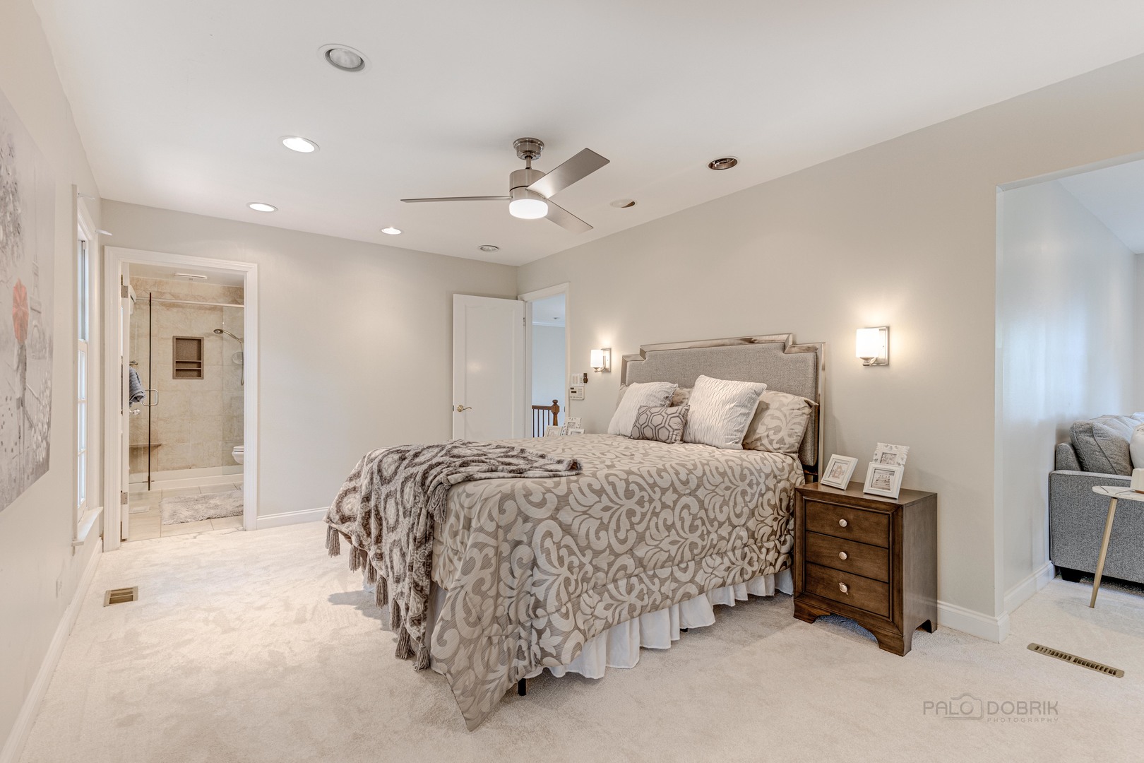 755 Smoke Tree Road Deerfield, IL 60015 - Photo 21 of 35 a spacious bedroom with a bed and a chandelier