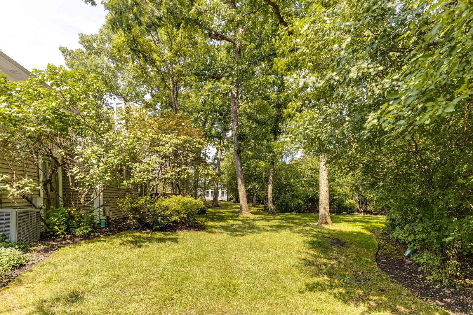 755 Smoke Tree Road Deerfield, IL 60015 - Photo 30 of 35 a swimming pool with trees in the background