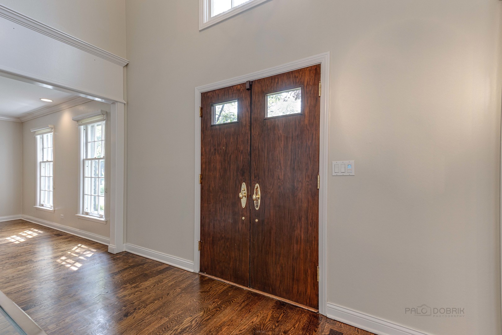 755 Smoke Tree Road Deerfield, IL 60015 - Photo 4 of 35 an empty room with wooden floor mirror and windows