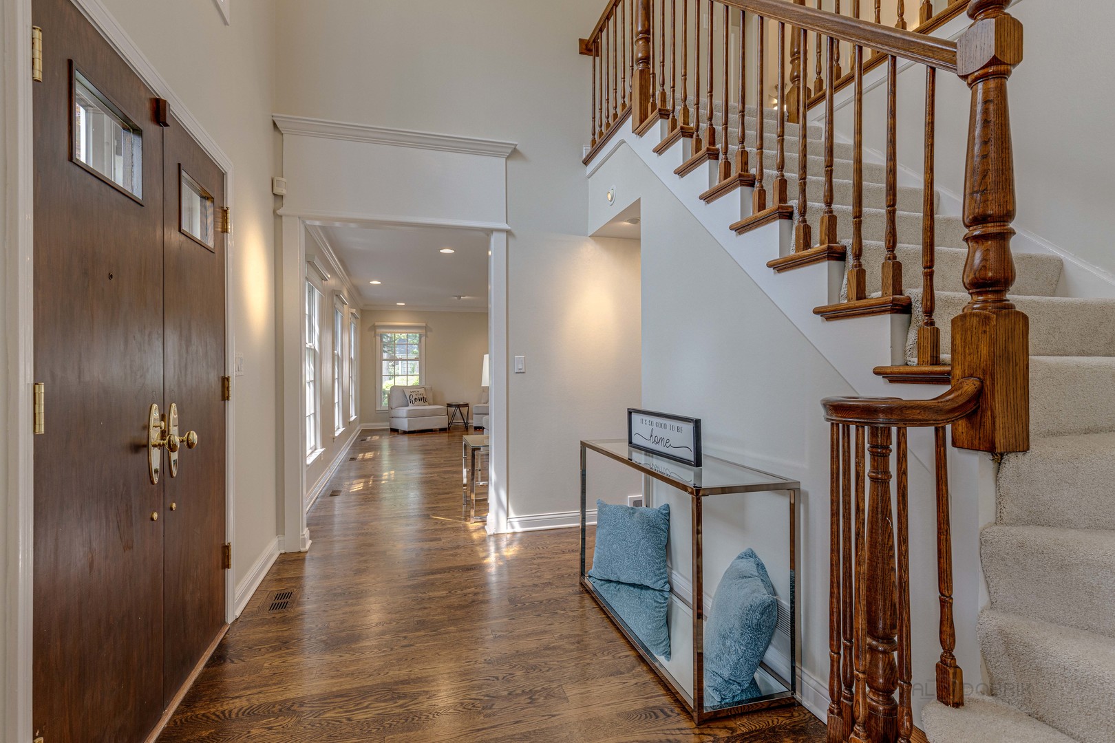 755 Smoke Tree Road Deerfield, IL 60015 - Photo 5 of 35 a view of a hallway with wooden floor and staircase