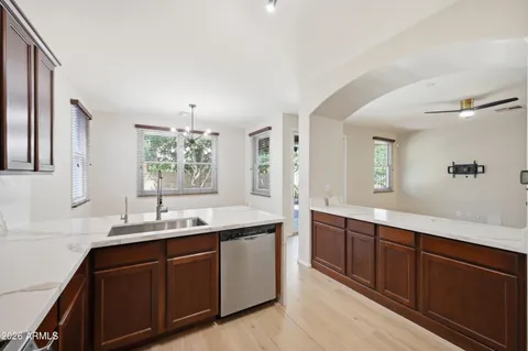 a bathroom with double sink and a mirror