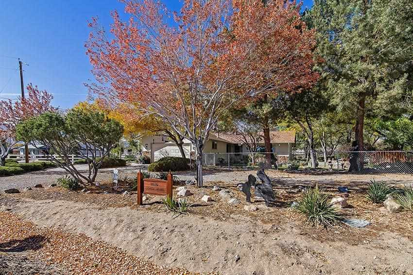 11625 Osage Road Reno, NV 89508 - Photo 1 of 1 a backyard of a house with barbeque oven table and chairs