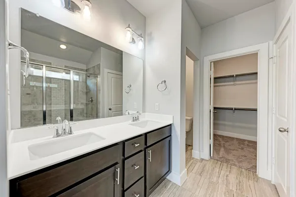 a bathroom with a sink double vanity and a mirror