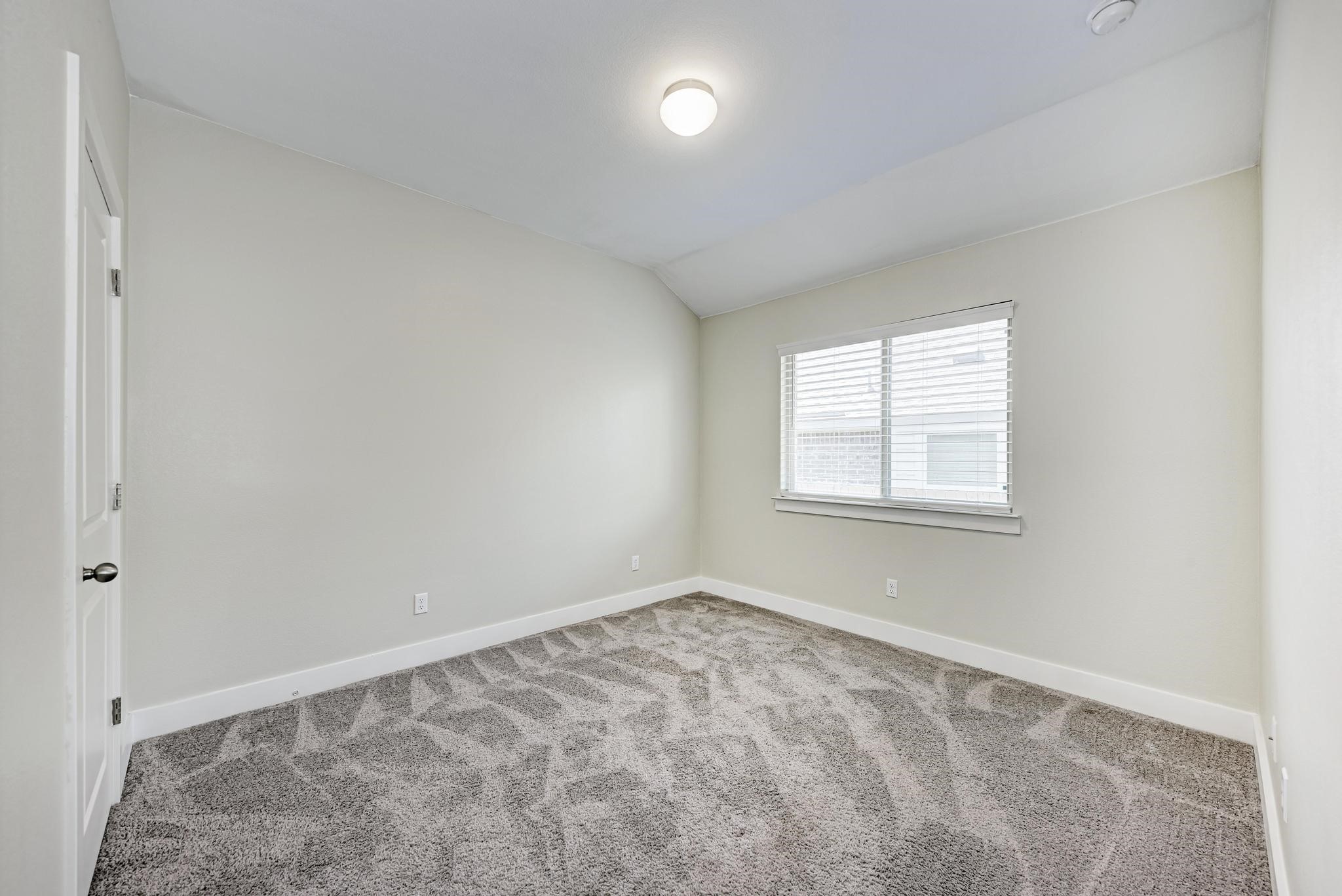 189 Tailwind Drive Kyle, TX 78640 - Photo 26 of 40 an empty room with a window