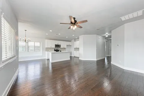 a view of a kitchen with a sink and a window