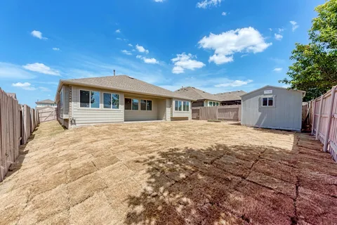 a view of a house with a patio