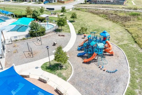 an aerial view of a house with a swimming pool