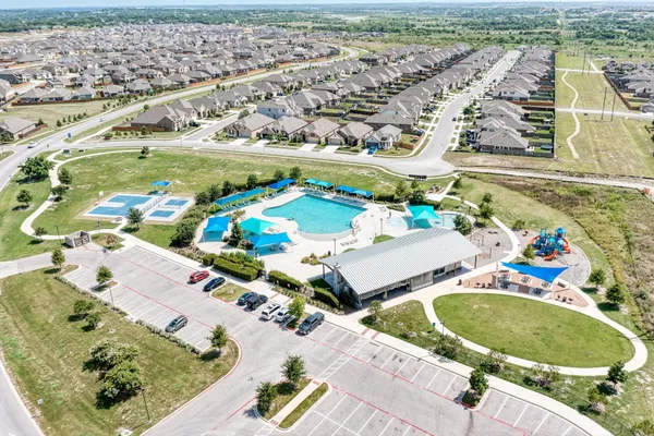 an aerial view of a swimming pool and outdoor space